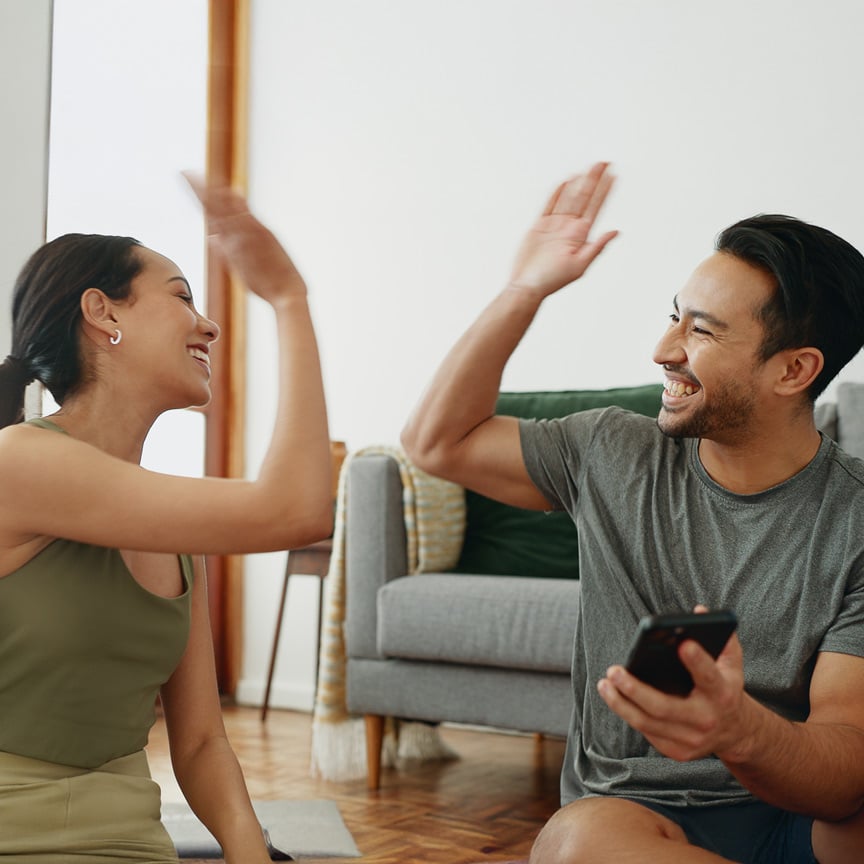 Couple high fiving each other